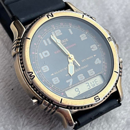 Rare CASIO Rookie RKA500 ana-digi watch with black dial and gold hands.