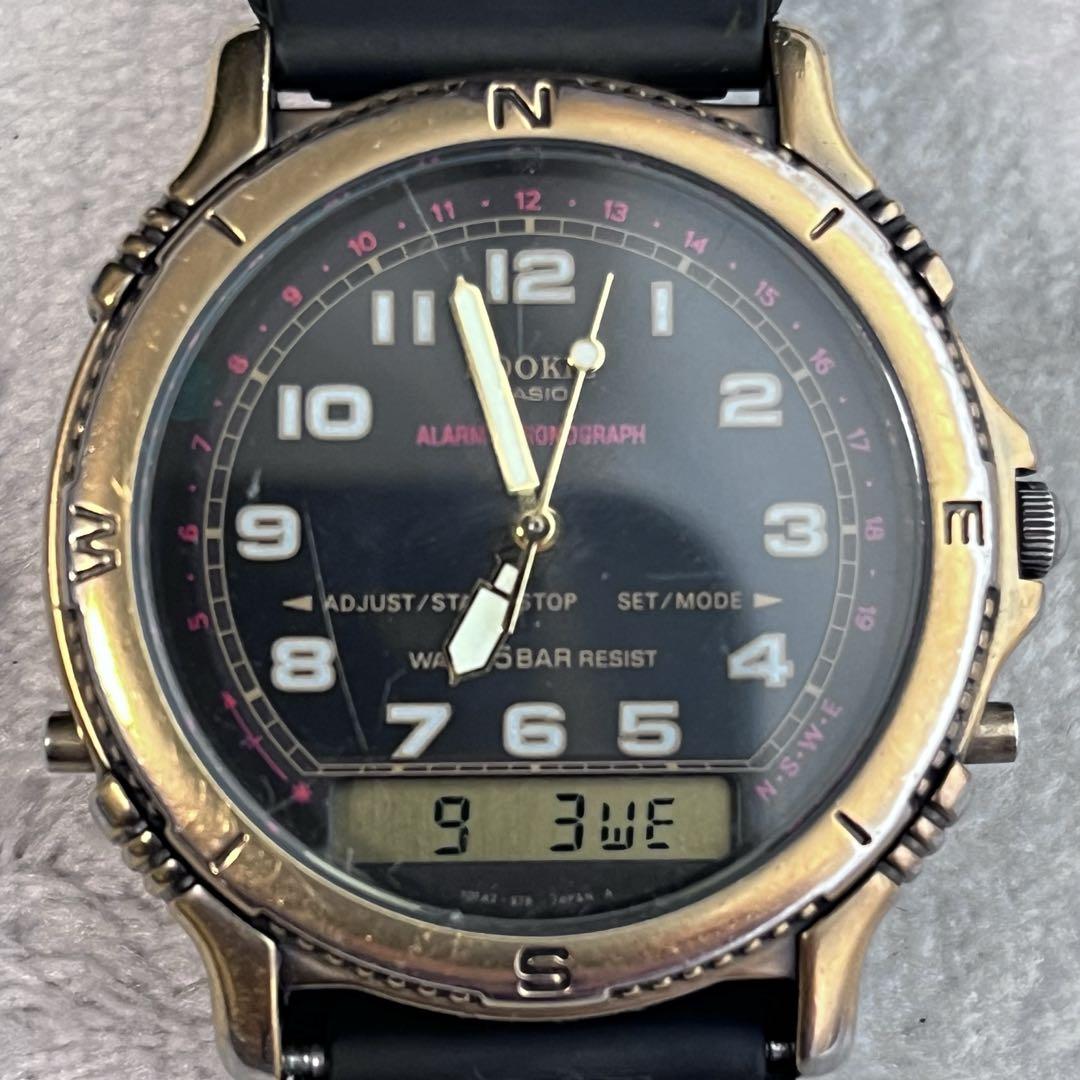 Rare CASIO Rookie RKA500 ana-digi watch with black dial and gold hands.
