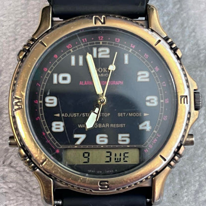 Rare CASIO Rookie RKA500 ana-digi watch with black dial and gold hands.