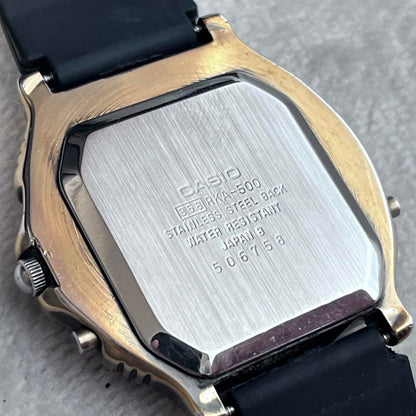 Rare CASIO Rookie RKA500 ana-digi watch with black dial and gold hands.