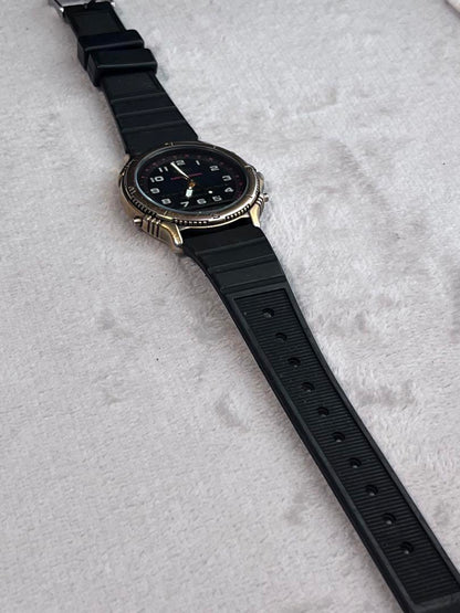 Rare CASIO Rookie RKA500 ana-digi watch with black dial and gold hands.