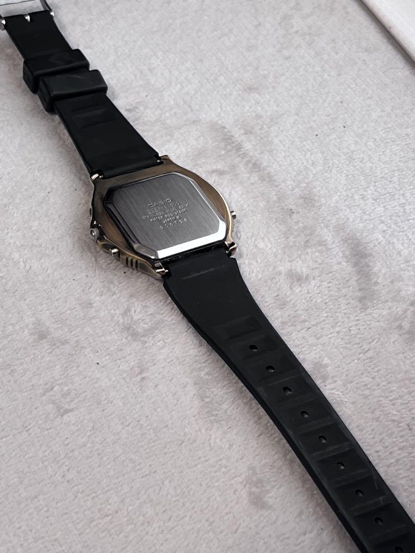 Rare CASIO Rookie RKA500 ana-digi watch with black dial and gold hands.