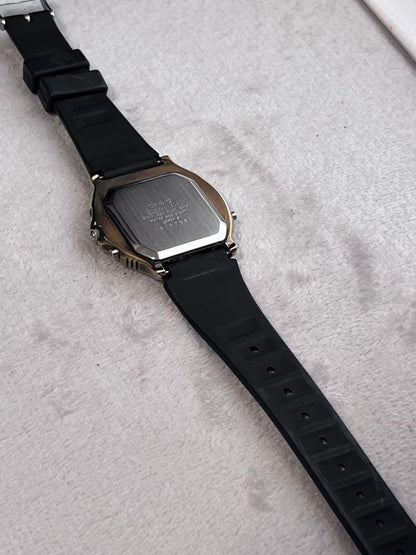 Rare CASIO Rookie RKA500 ana-digi watch with black dial and gold hands.