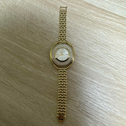 Swarovski Crystal Line Oval Gold Tone Bangle Watch