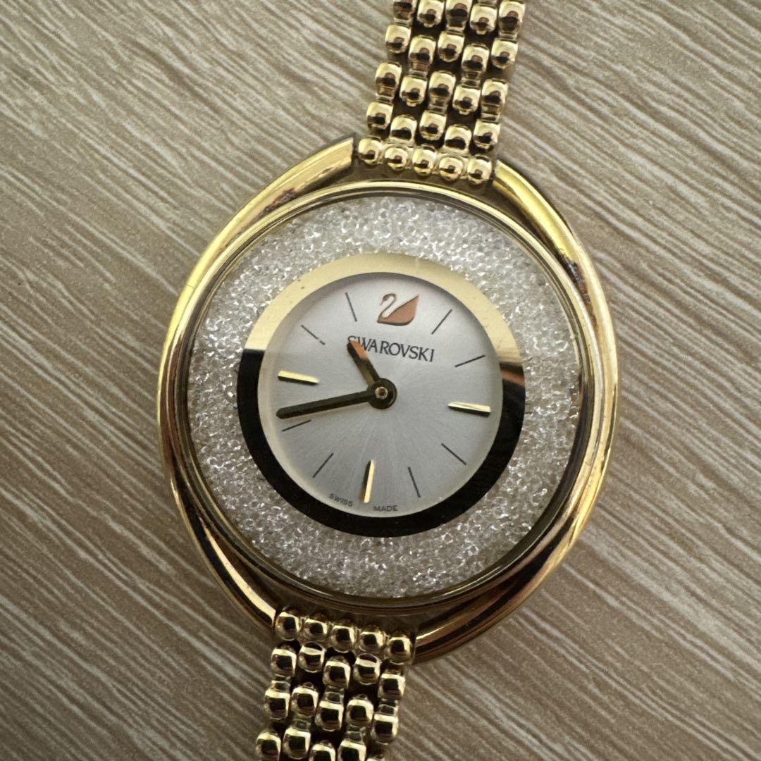 Swarovski Crystal Line Oval Gold Tone Bangle Watch