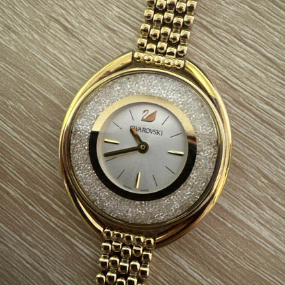 Swarovski Crystal Line Oval Gold Tone Bangle Watch