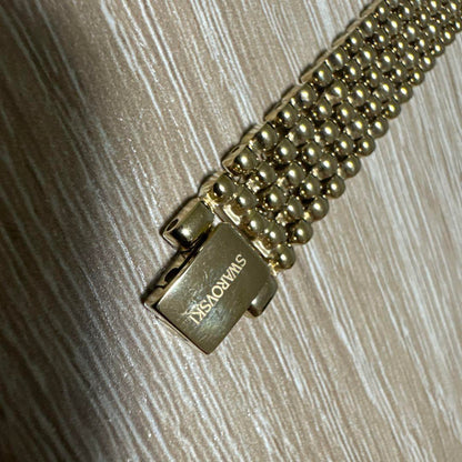 Swarovski Crystal Line Oval Gold Tone Bangle Watch