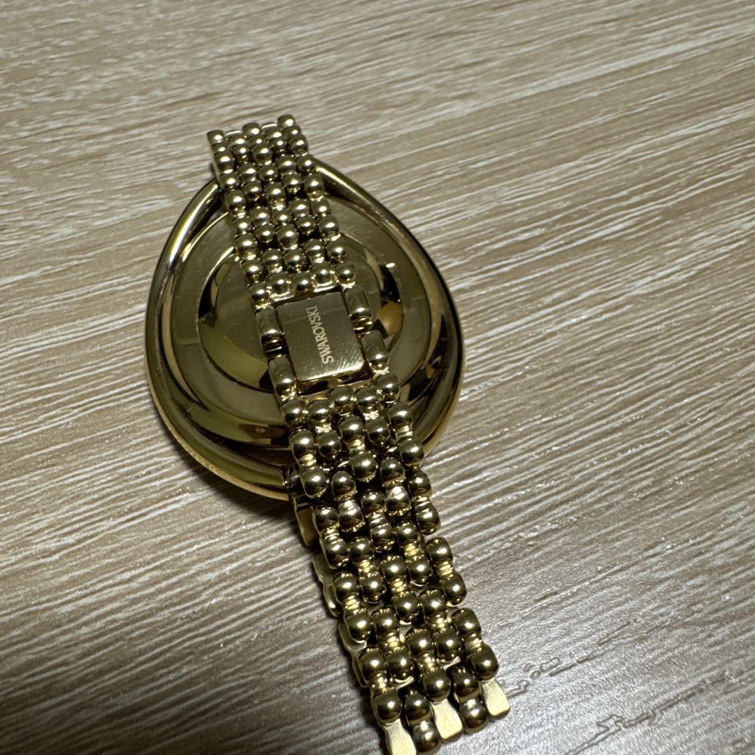 Swarovski Crystal Line Oval Gold Tone Bangle Watch