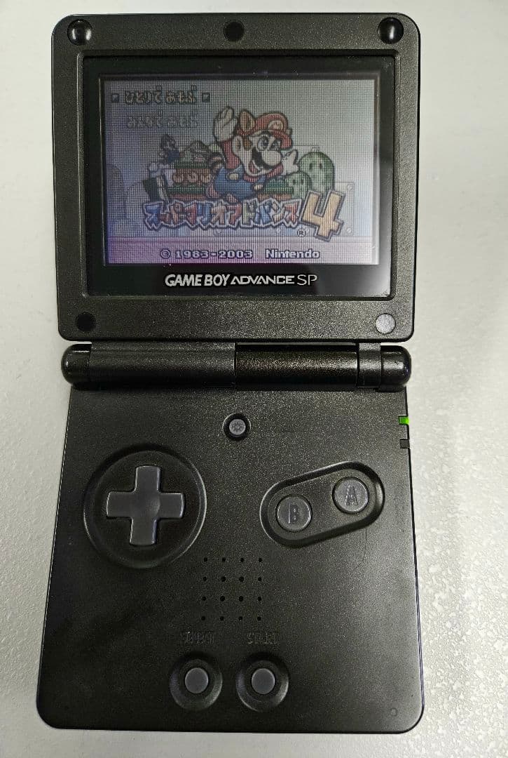 Game Boy Advance SP Black + Charger + Super Mario Advance 4