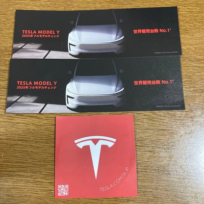 Tesla Model Y 2025 Model Catalog, 2 Tickets and Sticker